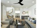 Bright living room with modern furnishings, stairs, and an open view to the kitchen at 8055 E Thomas Rd # E117, Scottsdale, AZ 85251