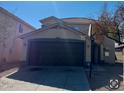 Two-story house with a brown garage door and basketball hoop at 6245 W Southgate St, Phoenix, AZ 85043