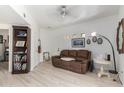 Living room with brown leather couch and wood floors at 3434 E Baseline Rd # 259, Phoenix, AZ 85042