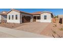 House exterior showcasing a brown garage door and landscaped yard at 16372 W Avenida Del Sol --, Surprise, AZ 85387