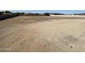 A vast, empty residential lot with great potential for building a custom home at 1101 E Dolores Rd, Phoenix, AZ 85086