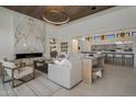 Open living space featuring a marble fireplace and comfortable seating at 24863 N 103Rd N Way, Scottsdale, AZ 85255