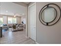 Bright hallway with a large mirror and view into living room at 17983 E Vista Desierto --, Rio Verde, AZ 85263