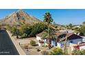 Ranch-style house with desert landscaping and mountain backdrop at 2320 E Shangri La Rd, Phoenix, AZ 85028
