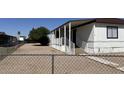 Ramp leading to this adorable home with covered porch and fenced yard at 8730 E Dolega Ave, Mesa, AZ 85208