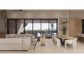 Bright living area showcasing an open floor plan, hardwood floors, and floor to ceiling windows with sliding glass door at 12232 N 65Th Pl, Scottsdale, AZ 85254