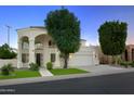 Two-story house with a landscaped front yard at 1521 W Commerce Ave, Gilbert, AZ 85233