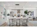 Modern kitchen with marble island, stainless steel appliances, and white cabinetry at 1501 N Miller Rd # 1011, Scottsdale, AZ 85257