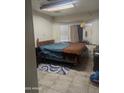 View of a bedroom featuring a bed, rug, and window at 3802 N 79Th Ave, Phoenix, AZ 85033