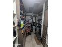 Inside look at a walk-in closet with shelves, hanging clothes, and storage at 3802 N 79Th Ave, Phoenix, AZ 85033