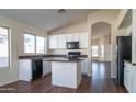 Spacious kitchen with island, granite countertops, and white cabinets at 5730 E Holmes Ave, Mesa, AZ 85206