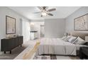 Relaxing bedroom with neutral paint, carpet, and modern decor with easy access to the ensuite bathroom at 9275 E Mission Ln # 215, Scottsdale, AZ 85258