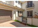 View of the garage and side entrance with a gate at 3799 S Skyline Dr, Gilbert, AZ 85297