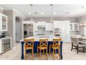 Spacious kitchen with island, stainless steel appliances, and white cabinets at 3799 S Skyline Dr, Gilbert, AZ 85297