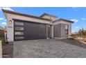 Beautiful single-Gathering home offers an attached garage and attractive desert landscaping at 4353 N 203Rd Ave, Buckeye, AZ 85396