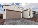 Beautiful home with a neutral palette and an attached two-car garage at 4359 N 203Rd Ave, Buckeye, AZ 85396