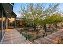 Wooden walkway, glass railings, desert plants at 9556 E Celestial Dr, Scottsdale, AZ 85262