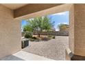View of backyard through covered patio at 42459 W Paseo Dr, Maricopa, AZ 85138
