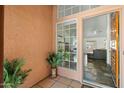 Inviting entryway with tiled flooring, wood door, and view into living room at 4924 W Boston St, Chandler, AZ 85226