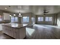 Modern kitchen with a large island and granite countertops at 3915 N Juniper Dr, Eloy, AZ 85131