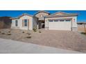 Single story home with light colored exterior and a two-car garage at 19014 W Ocotillo Rd, Waddell, AZ 85355