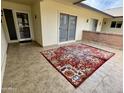 Spacious tiled porch featuring a decorative rug and a welcoming atmosphere at 10931 W Peoria Ave, Sun City, AZ 85351