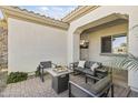 Relaxing outdoor patio with fire pit and seating area at 18223 W Rancho Ct, Litchfield Park, AZ 85340