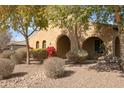 House exterior showcasing landscaping and a metal deer statue at 18206 W Sells Dr, Goodyear, AZ 85395