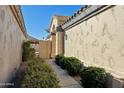 Landscaped walkway leading to the side entrance of the home at 14535 W Zuni Trl, Surprise, AZ 85374