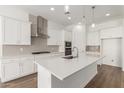 Well-equipped kitchen boasting a large island, stainless steel appliances, and white cabinetry for a clean, modern look at 12012 W Parkway Ln, Avondale, AZ 85323