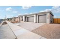 New construction home showcasing a three-car garage and attractive facade at 22886 E Alyssa Rd, Queen Creek, AZ 85142