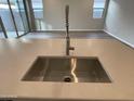 Modern kitchen sink and faucet with a large countertop at 9987 W Verde Ln, Avondale, AZ 85392