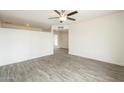 An alternate view of this large living area, which features wood-look tile flooring and neutral walls at 18009 N 15Th Dr, Phoenix, AZ 85023