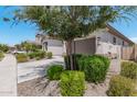 Landscaped yard with driveway and partial home view at 22630 E Mewes Rd, Queen Creek, AZ 85142