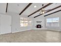 Living room features a fireplace and wood beam ceiling at 748 W Coolidge St, Phoenix, AZ 85013