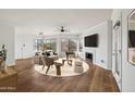 Living room with hardwood floors, fireplace, and stylish furniture at 7575 E Indian Bend Rd # 2081, Scottsdale, AZ 85250