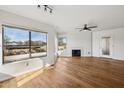 Living room with hardwood floors, fireplace and large windows at 7575 E Indian Bend Rd # 2081, Scottsdale, AZ 85250