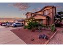 Charming two-story home featuring desert landscaping and a two-car garage at 14244 W Indianola Ave, Goodyear, AZ 85395