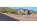 Charming single-story home featuring a stucco exterior, covered parking, desert landscaping, and a well-maintained driveway at 8006 S 38Th Pl, Phoenix, AZ 85042