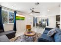 Inviting living area with a neutral palette, comfortable seating, and a view into the adjacent dining space at 322 N 11Th Pl, Phoenix, AZ 85006