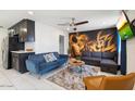 Stylish living room showcasing a vibrant art piece, comfortable seating, and bright, neutral flooring at 322 N 11Th Pl, Phoenix, AZ 85006