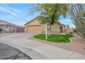 Front view of a single-story house with a garage and a neatly kept lawn at 14727 N Gil Balcome N Ct, Surprise, AZ 85379