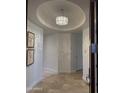Bright foyer featuring a decorative chandelier and neutral color palette, creating an inviting entrance at 8 E Biltmore Est # 109, Phoenix, AZ 85016