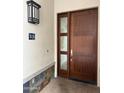 Modern front door with glass panel, address number, and stylish exterior light fixture at 8 E Biltmore Est # 109, Phoenix, AZ 85016