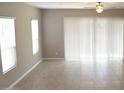 Large living room with tile flooring and sliding glass doors at 1255 N Arizona Ave # 1099, Chandler, AZ 85225