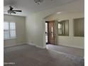 Living room with hardwood floors, neutral walls, and a view of the entryway at 1187 E Tonto Dr, Chandler, AZ 85249