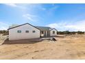 Modern single-story home with clean lines and desert setting at 22750 E Roper Ln, Florence, AZ 85132