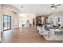 Bright living room showcasing hardwood floors, contemporary furnishings, and an open design concept at 3518 N Shadow Trl, Mesa, AZ 85207