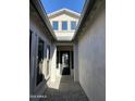 Light-filled entryway with high ceilings and a black front door at 1184 E Gleneagle Dr, Chandler, AZ 85249