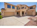 Beautiful two-story home with a three-car garage and desert landscaping at 15115 W Cottonwood St, Surprise, AZ 85374